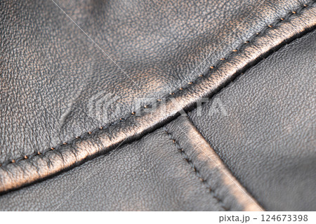 Leather texture background. Part of perforated black leather details. Perforated leather texture background. Texture leather Leather texture background. Part of perforated black leather details. Perforated leather texture background. Texture leather 124673398