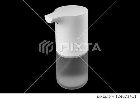 Modern automatic soap dispenser isolated on black background. Sensor soap dispenser Modern automatic soap dispenser isolated on black background. Sensor soap dispenser 124673411