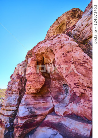 Sandstone Cliff with Natural Arch in Grand Staircase Desert Low Angle View Sandstone Cliff with Natural Arch in Grand Staircase Desert Low Angle View 124673453