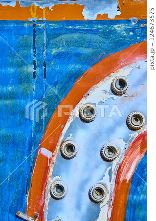 Weathered Bolts on Vintage Machinery with Peeling Paint Close-Up 124673575