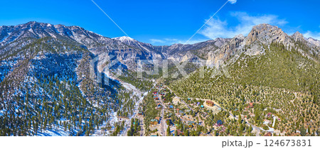 Aerial of Snow-Capped Mt Charleston and Remote Nevada Community 124673831