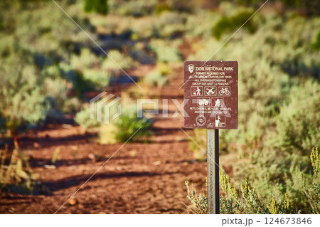 Zion National Park Signpost Regulations Desert Path Golden Hour View Zion National Park Signpost Regulations Desert Path Golden Hour View 124673846