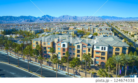 Aerial of Mediterranean Apartments and Mountain Backdrop 124674338