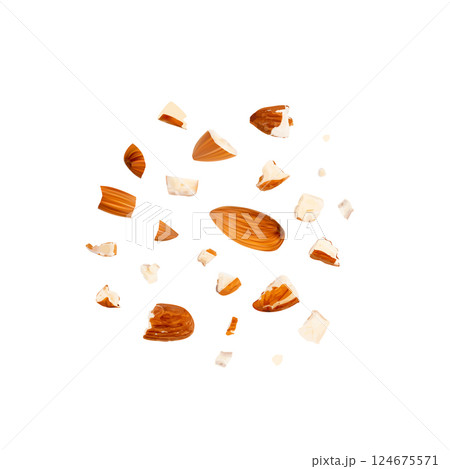 Crushed almonds isolated, nut pieces, sliced scattered almond seeds and cut kernels on white Crushed almonds isolated, nut pieces, sliced scattered almond seeds and cut kernels on white 124675571
