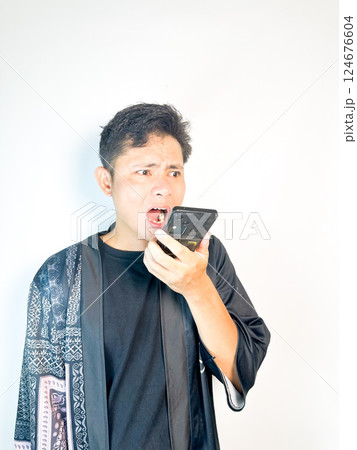 Surprised Man Receiving a Voice Message Surprised Man Receiving a Voice Message 124676604