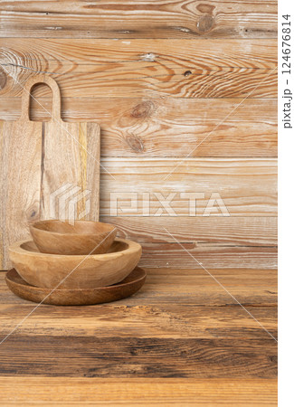 Empty wood bowl on table, plate stack on wooden table, light rustic dish mockup fabric, eco bio Empty wood bowl on table, plate stack on wooden table, light rustic dish mockup fabric, eco bio 124676814