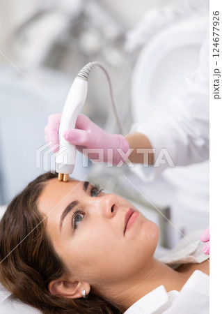 Young woman having face radiolifting procedure Young woman having face radiolifting procedure 124677926