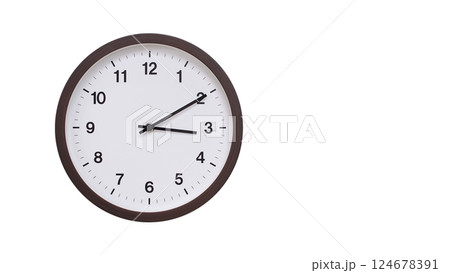A simple round wall clock with a dark brown frame and a white face displaying 03:10/15:10. Isolated on a white background, perfect for time-related concepts, deadlines, and schedule themes. 124678391