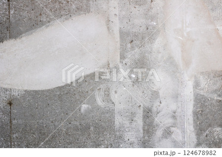Close up of a concrete wall with a noticeable white stain Close up of a concrete wall with a noticeable white stain 124678982