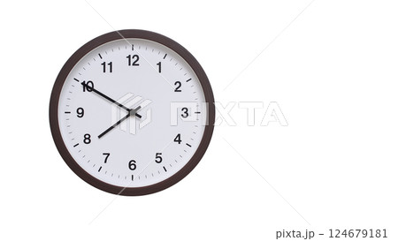 A simple round wall clock with a dark brown frame and a white face displaying 07:50/19:50. Isolated on a white background, perfect for time-related concepts, deadlines, and schedule themes. 124679181