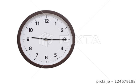 A simple round wall clock with a dark brown frame and a white face displaying 09:15/21:15. Isolated on a white background, perfect for time-related concepts, deadlines, and schedule themes. 124679188