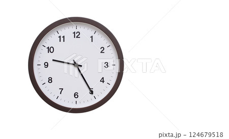 A simple round wall clock with a dark brown frame and a white face displaying 09:25/21:25. Isolated on a white background, perfect for time-related concepts, deadlines, and schedule themes. 124679518