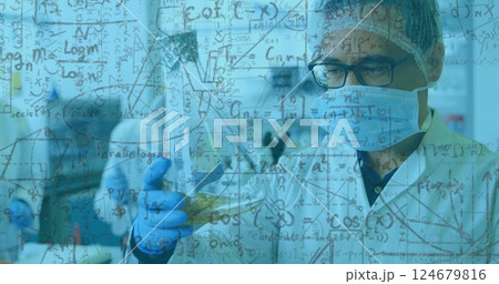 Scientific formulas and equations image over scientists conducting experiments in laboratory Scientific formulas and equations image over scientists conducting experiments in laboratory 124679816
