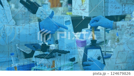 Mathematical equations image over scientists working with lab equipment and test tubes 124679826