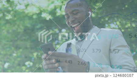 Image of financial data processing over african american man using smartphone Image of financial data processing over african american man using smartphone 124680107