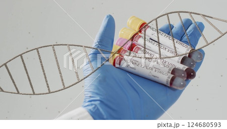 Image of dna strand spinning over hand with test tubes with blood on white background Image of dna strand spinning over hand with test tubes with blood on white background 124680593
