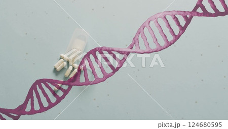 Image of dna strand spinning over pills on white background Image of dna strand spinning over pills on white background 124680595