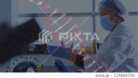 Image of dna strand over caucasian female scientist in laboratory Image of dna strand over caucasian female scientist in laboratory 124680759