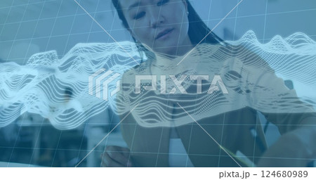 Image of connections and data processing over biracial businesswoman in office 124680989