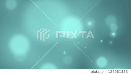 Image of glowing light spots moving over blue background 124681328