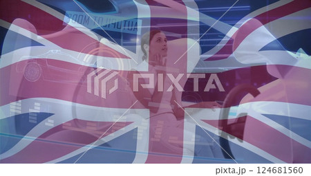 Image of flag of uk over caucasian woman sitting in modern car 124681560