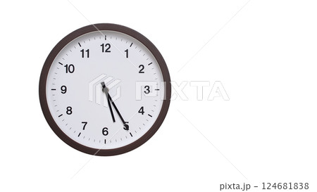 A simple round wall clock with a dark brown frame and a white face displaying 05:25/17:25. Isolated on a white background, perfect for time-related concepts, deadlines, and schedule themes. 124681838