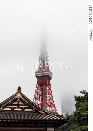 Tokyo Tower disappearing into dense fog while the traditional Zojo-ji temple 124681854