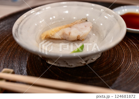 Lightly fried thread-sail filefish sashimi served in a handcrafted ceramic bowl Lightly fried thread-sail filefish sashimi served in a handcrafted ceramic bowl 124681872