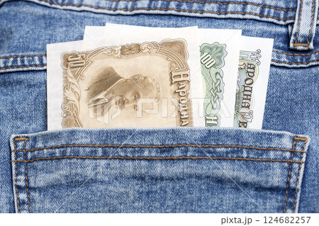 Old Bulgarian lev in the pocket of blue jeans 124682257