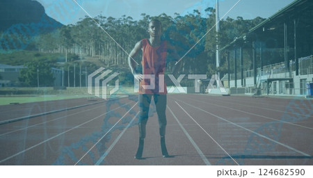 DNA strand and data processing image over athlete standing on running track DNA strand and data processing image over athlete standing on running track 124682590