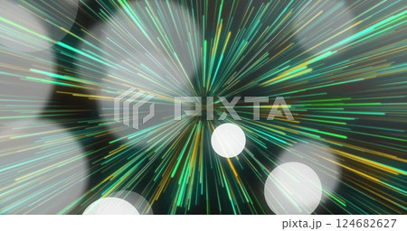 Colorful light streaks radiating outward over abstract image background 124682627