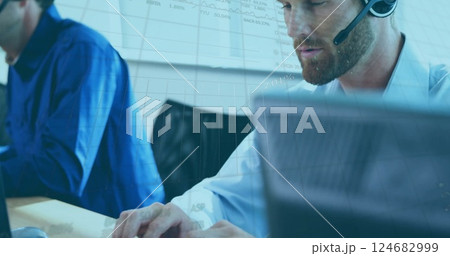 Image of data on graph processing over caucasian businessman wearing headset using computer 124682999