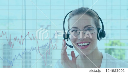 Image of data on graph processing over happy caucasian businesswoman wearing headset Image of data on graph processing over happy caucasian businesswoman wearing headset 124683001