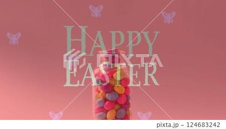Image of happy easter text over colourful eggs in jar on pink background 124683242