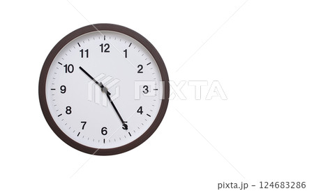 A simple round wall clock with a dark brown frame and a white face displaying 10:25/22:25. Isolated on a white background, perfect for time-related concepts, deadlines, and schedule themes. 124683286