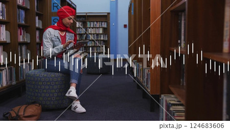 Image of diagram over biracial woman using tablet 124683606