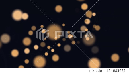 Image of glowing light spots over black background Image of glowing light spots over black background 124683621