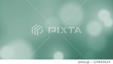 Image of glowing light spots over green background 124683624