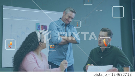 Image of ecology icons and data processing over diverse colleagues discussing work in office 124683718