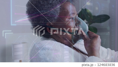 Image of data processing and diagrams over senior biracial woman using oxygen mask Image of data processing and diagrams over senior biracial woman using oxygen mask 124683836
