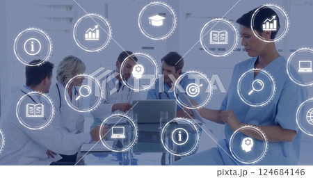 Image of digital icons and data processing over diverse business people in office Image of digital icons and data processing over diverse business people in office 124684146