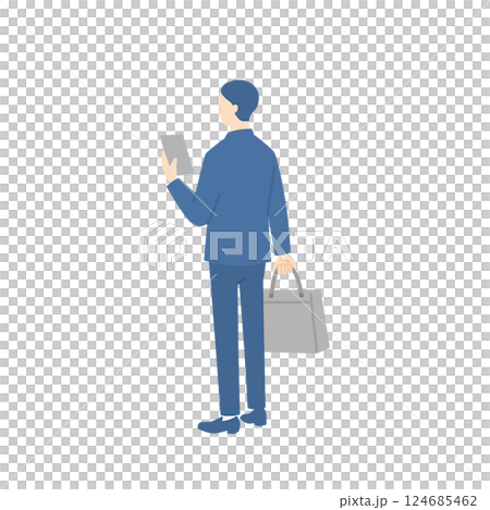 一位商人拿著商務包並檢查他的智慧型手機的後視圖 一位商人拿著商務包並檢查他的智慧型手機的後視圖 124685462