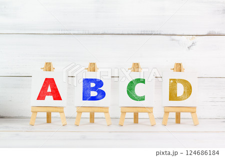 Colorful Alphabet Letters ABCD Displayed on Wooden Easels for Learning and Education Colorful Alphabet Letters ABCD Displayed on Wooden Easels for Learning and Education 124686184