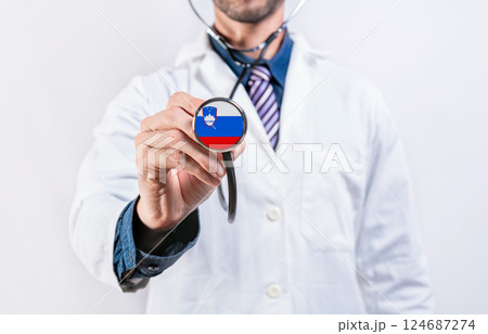 Slovenia healthcare system, doctor holding stethoscope. Slovenia health and medical insurance concept 124687274