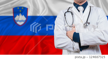 Male doctor with stethoscope on Slovenian flag. Doctor holding stethoscope on Slovenian flag Male doctor with stethoscope on Slovenian flag. Doctor holding stethoscope on Slovenian flag 124687325