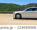 White sedan on scenic mountain route 124689006