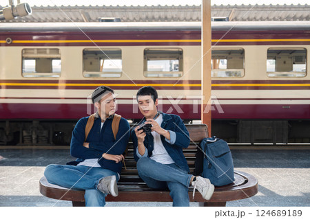 Capturing Memories and Bonding over Travel. Two friends sitting together and reviewing their travel photos. 124689189