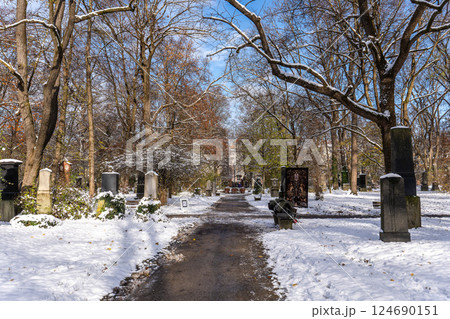 Munich, Germany - Nov 22, 2024: Winter view of famous Old North Cemetery of Munich, Germany with historic gravestones. 124690151