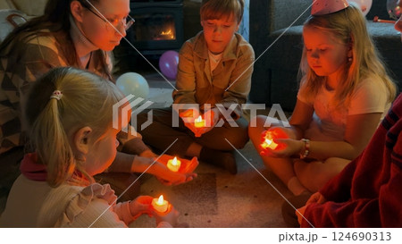 Children hold glowing hearts in their hands 124690313