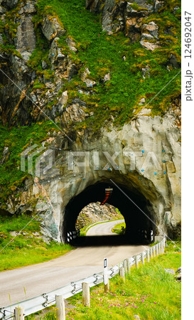 Road with old tunnel in mountains Norway 124692047